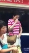 Asian woman sniffing downstairs on train