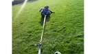 Co-Workers Laugh Their Way Around a Muddy Field While Towed by a Truck