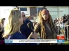 Sunrise reporter Michelle Tapper steals a kiss from Johnny Depp