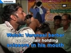 Watch: Varanasi barber cutting hair holding scissors in his mouth
