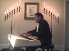 Darryl Adams-  Pianist  Performing on piano with candlelight.
