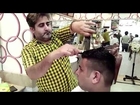 Barber’s unique haircuts require 15 pairs of scissors