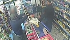 Brave shopkeeper defies thief pointing gun in his face