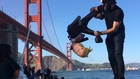 Smashing a Donald trump pinata under the Golden Gate Bridge