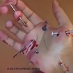 Guy puts nail through his hand to prove he can take pain