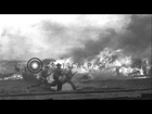 Bombed U.S. warplanes aflame as armed military personnel run past responding to J...HD Stock Footage