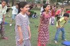 Dunya News - School children enjoy yoga training at a picnic point  during summer vacations