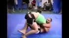 Female vs black male wrestling wrestling match MMA, figure four leg lock female, belly and head scissor